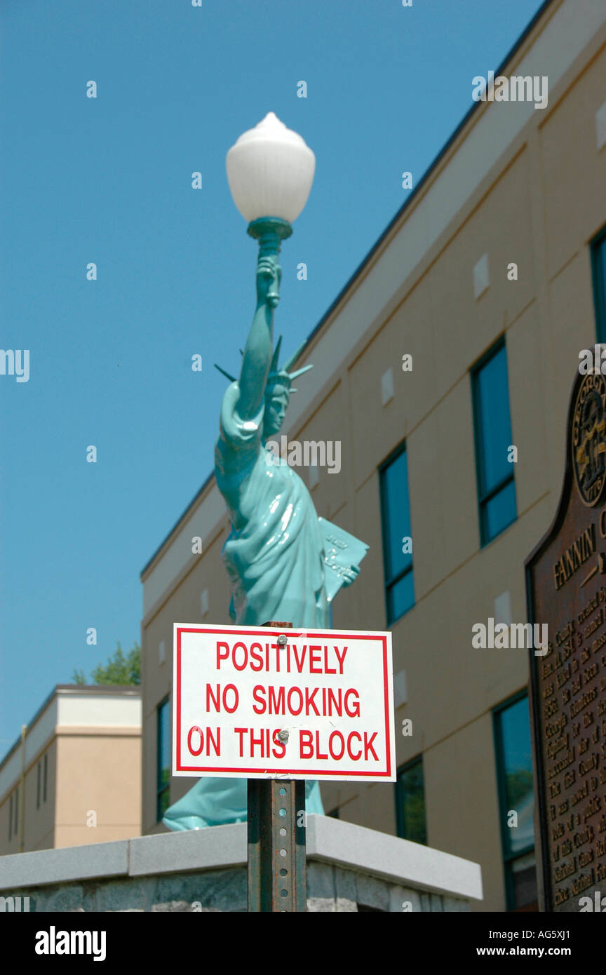 No Smoking by anyone on this city street or public block in Blue Ridge GA at Art Museum and replica of Statue of Liberty and Court house real USA Stock Photo
