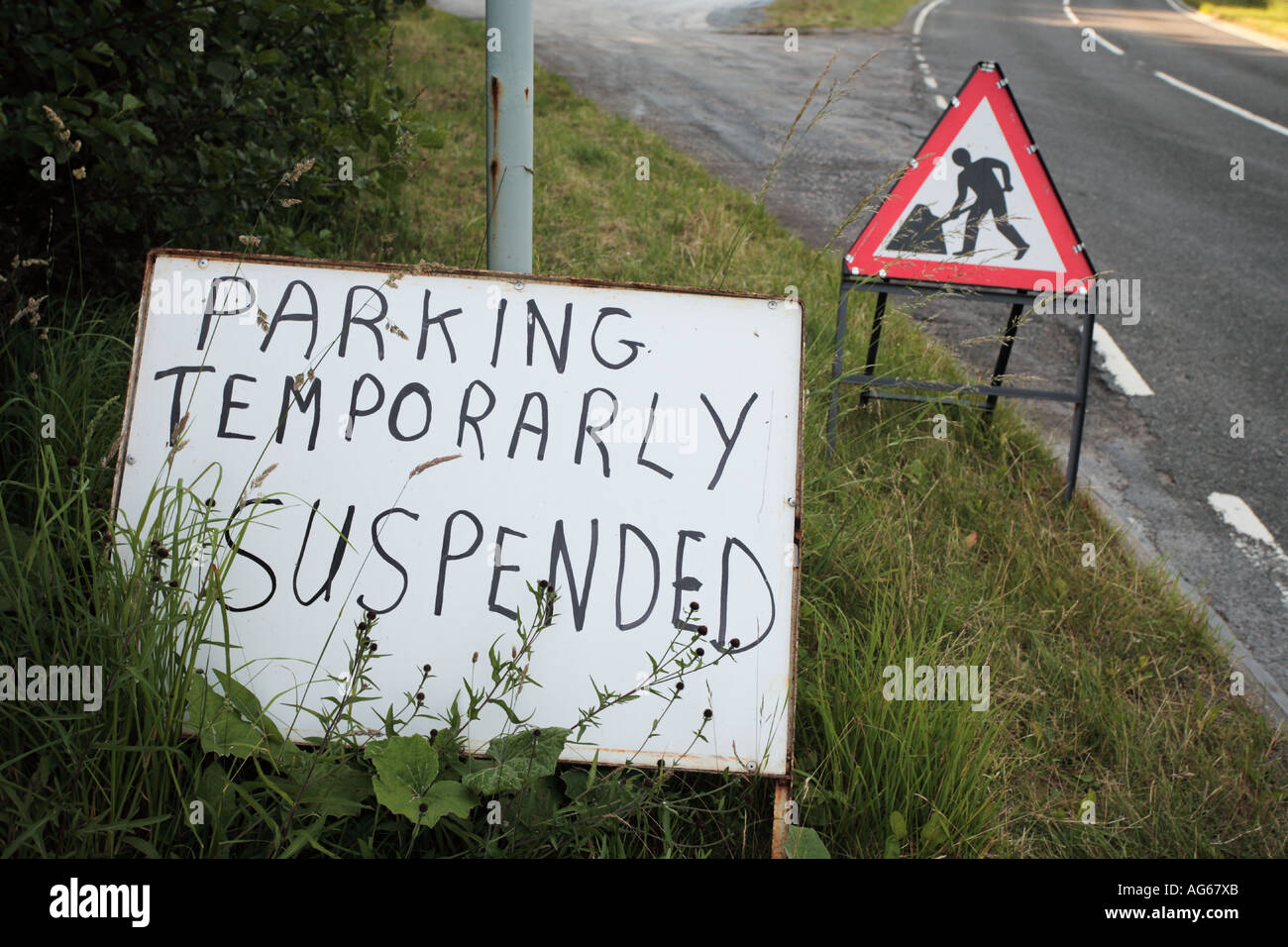 Parking temporarily suspended misspelt , Misspelling error, mispell,  misspellings, mistake, misspelt words on Scottish roadsign Scotland UK Stock Photo