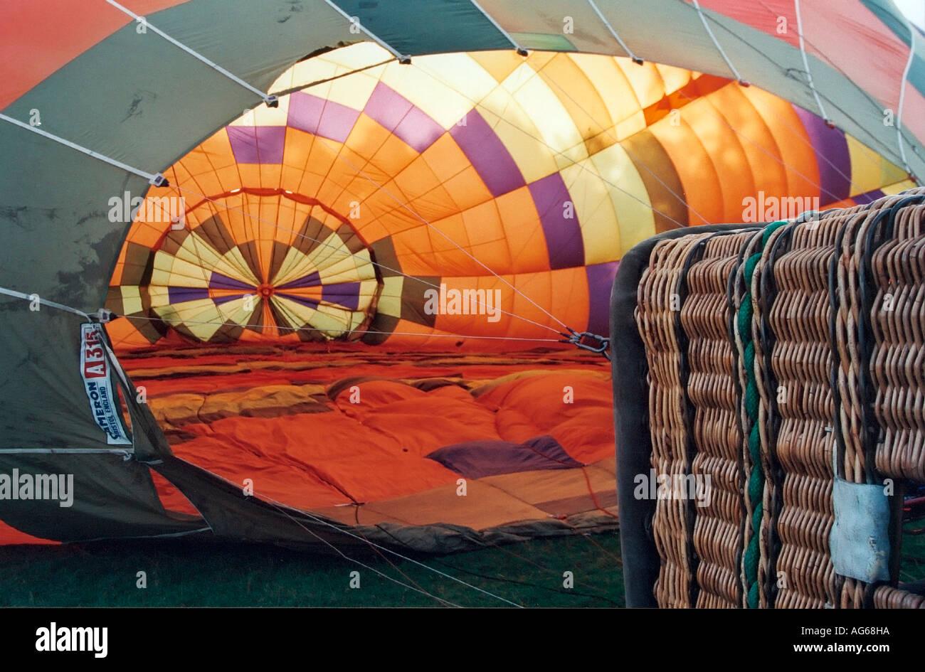 Hot air balloon lying on ground and being inflated pre flight Stock Photo