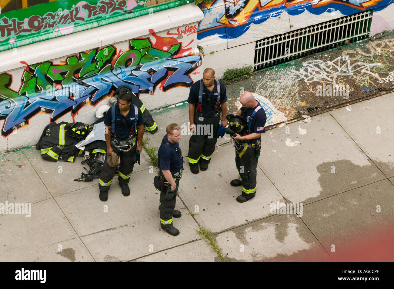 FDNY firemen after an apartment building fire in Harlem New York City