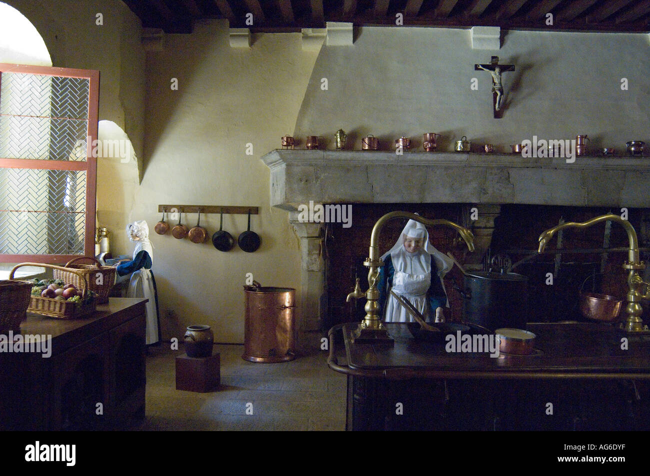 Kitchen interior tableau with nuns dressed in habits, Hospices de Beaune, Hotel Dieu, Burgundy, France Stock Photo