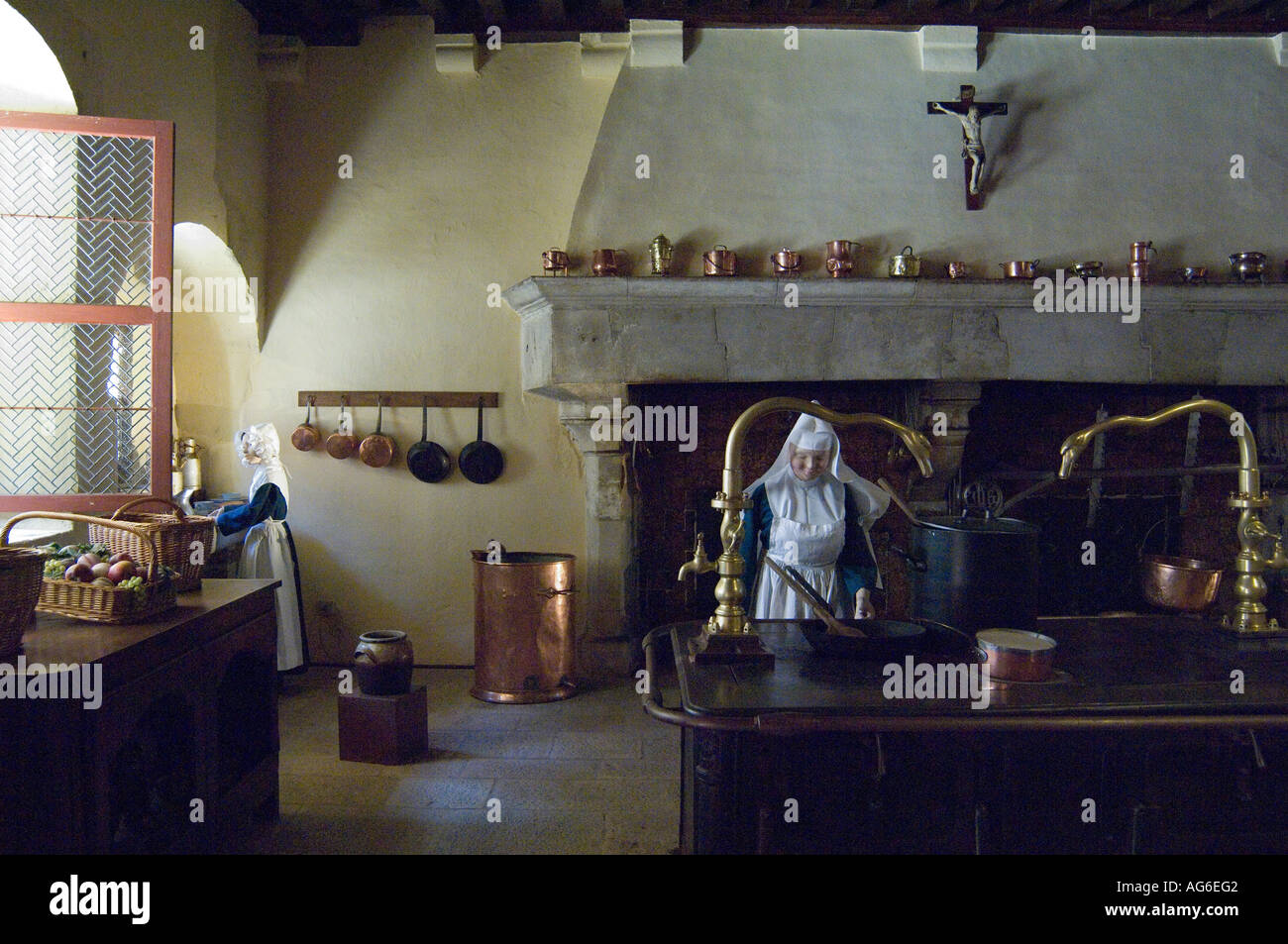 Kitchen tableau with nuns dressed in habit, Hospices de Beaune, Hotel Dieu, Burgundy, France Stock Photo
