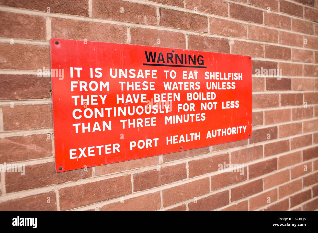 Sea wall with warning signs hi-res stock photography and images - Alamy