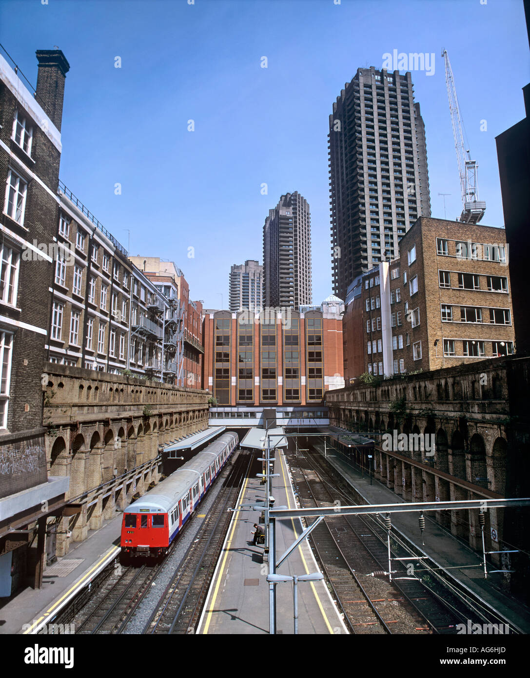 A London Underground train stops at the Barbican tube station in the City  of London Stock Photo - Alamy