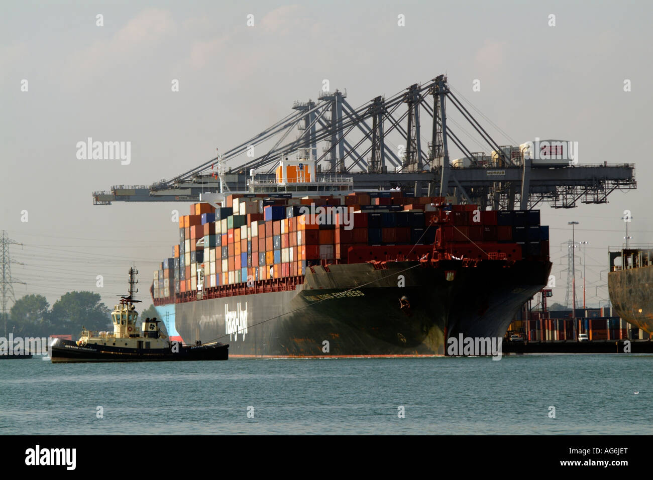 SGT Southampton Container Terminal Tug Adsteam Lyndhurst pulling Hong Kong Express a container ship operated by Hapag Lloyd from Stock Photo
