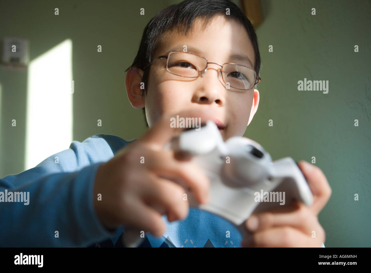japanese ten year old boy playing video game closeup Stock Photo Alamy