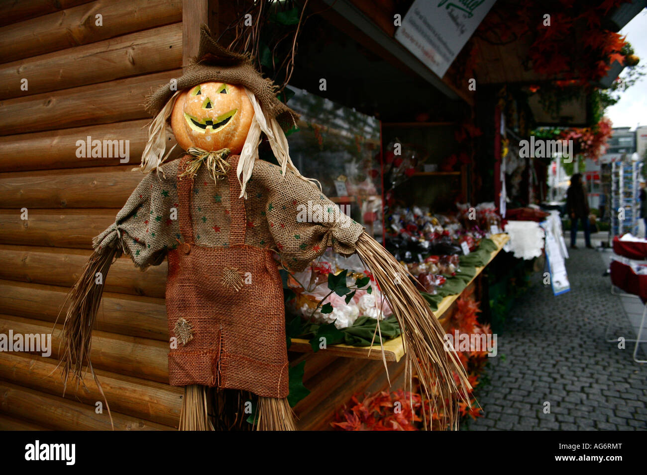 Pumpkin Straw doll on a stall in a German market in Dresden Stock Photo