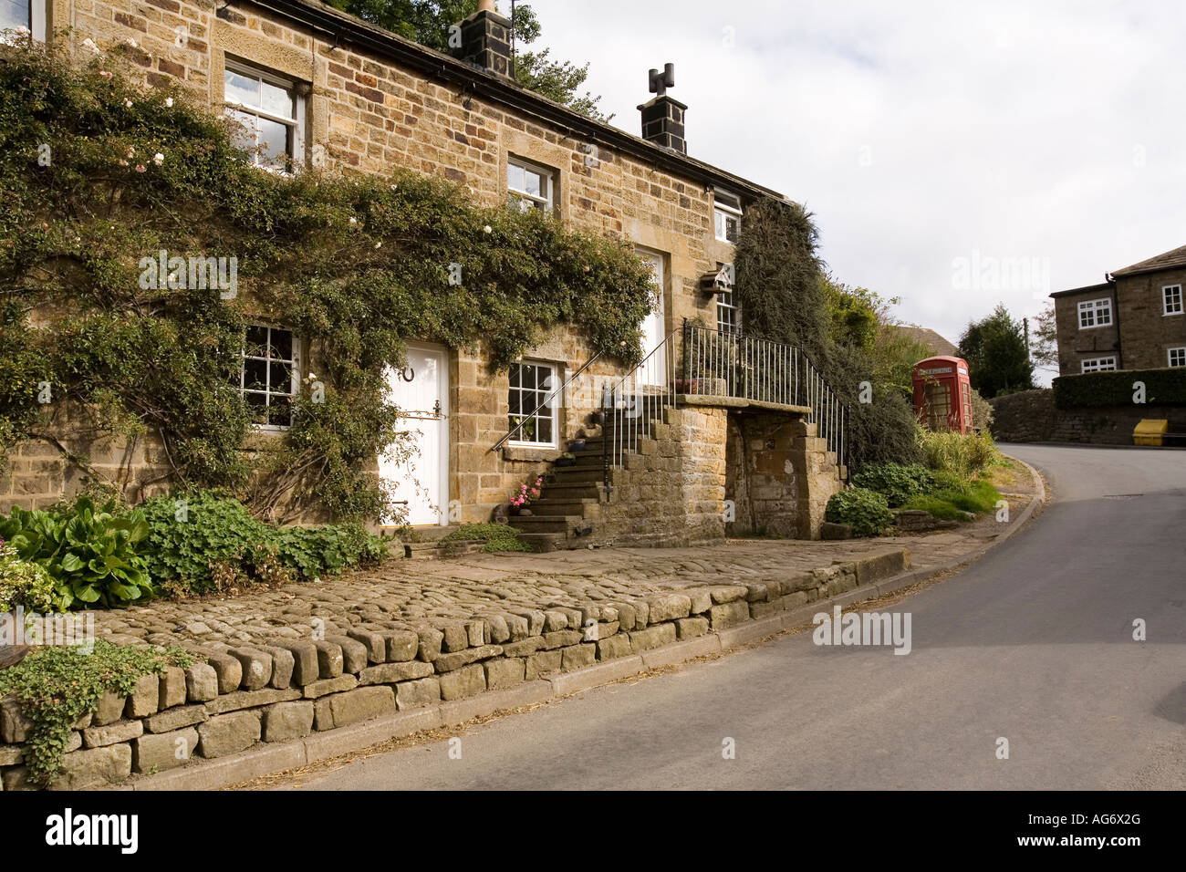 UK Yorkshire Nidderdale Middlesmoor village stone built house with barn