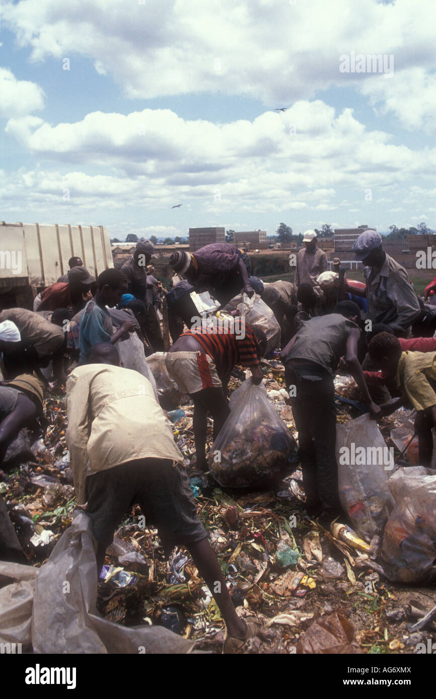 People looking for things to sell from the garbage heap in Korogocho slum area, nairobi, Kenya. Stock Photo