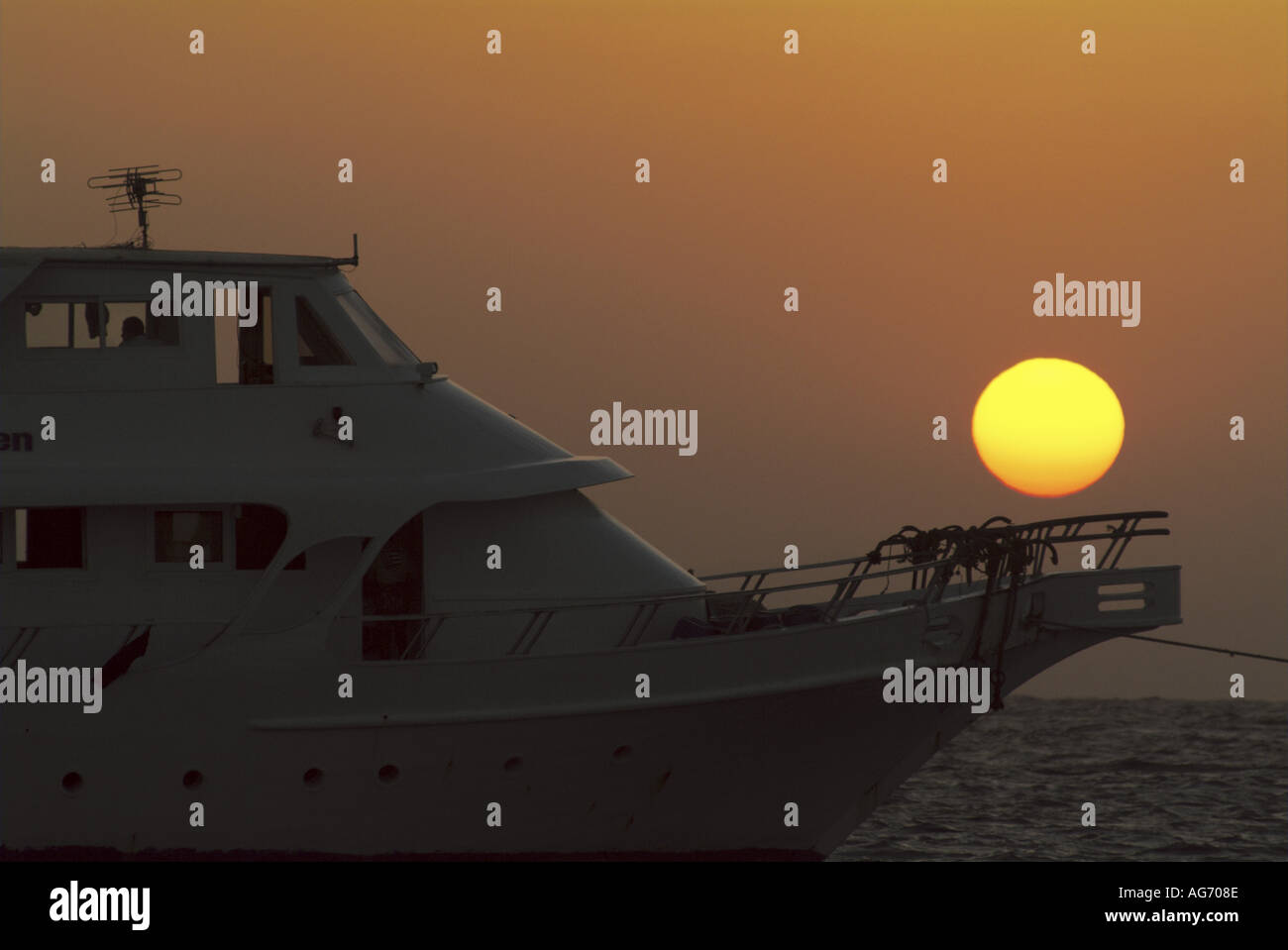 Sunset behind a boat on the Red Sea, Egypt. Stock Photo
