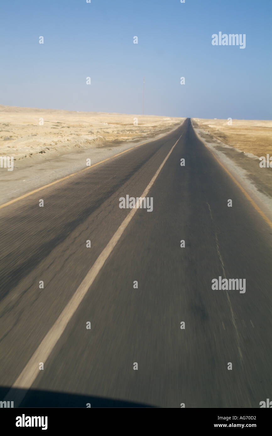 Egypt, Red Sea -  Driving on a straight empty desert road between Quoseir And Marsa Alam Stock Photo