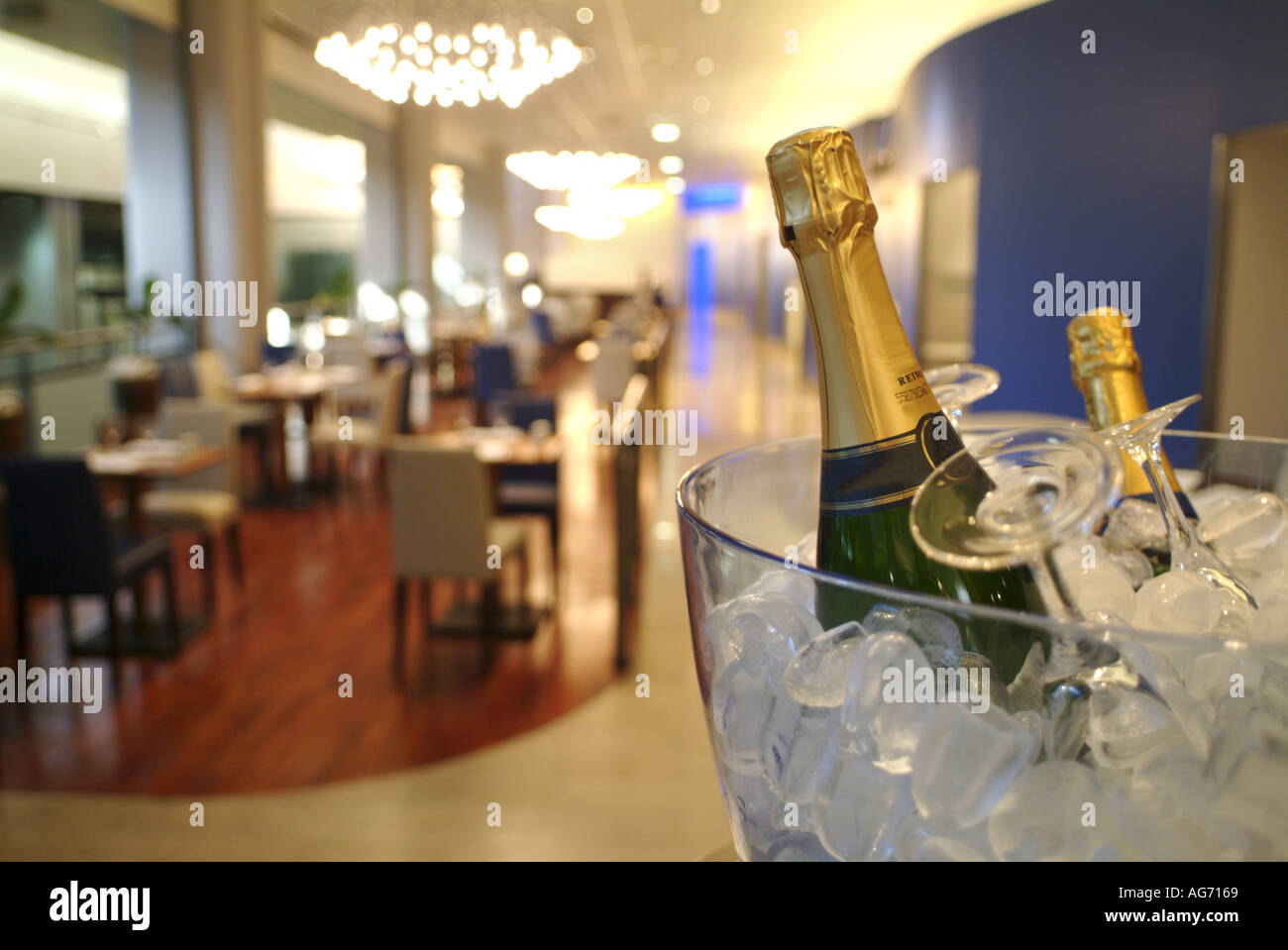 Champagne bottles cooling on ice in a restaurant Stock Photo