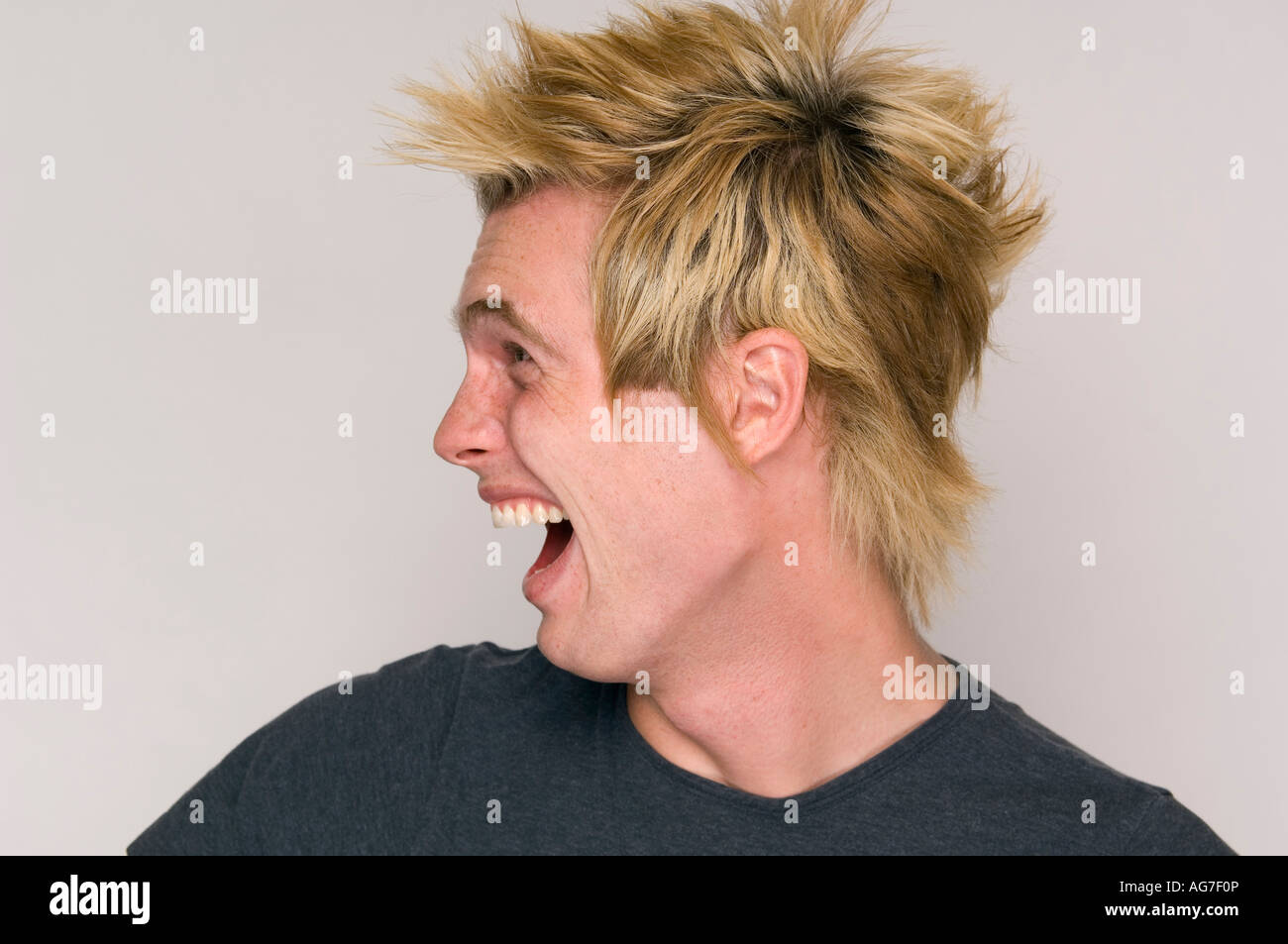 Crazy young urban male with wild haircut. Stock Photo