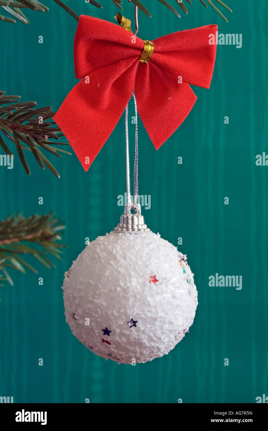 White Ball Christmas Decoration With Red Bow Stock Photo