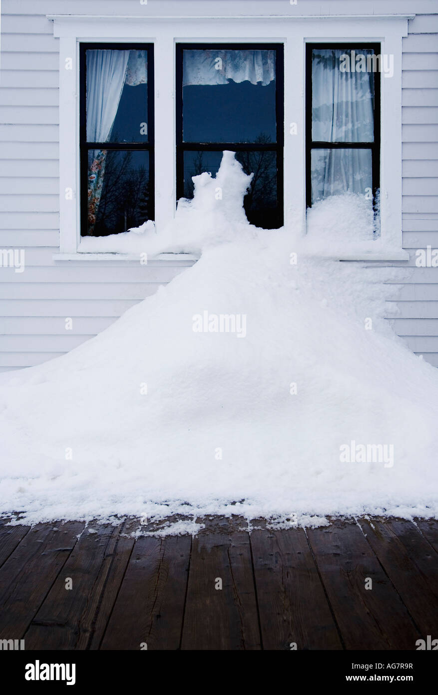Snowbank in front of a house Stock Photo