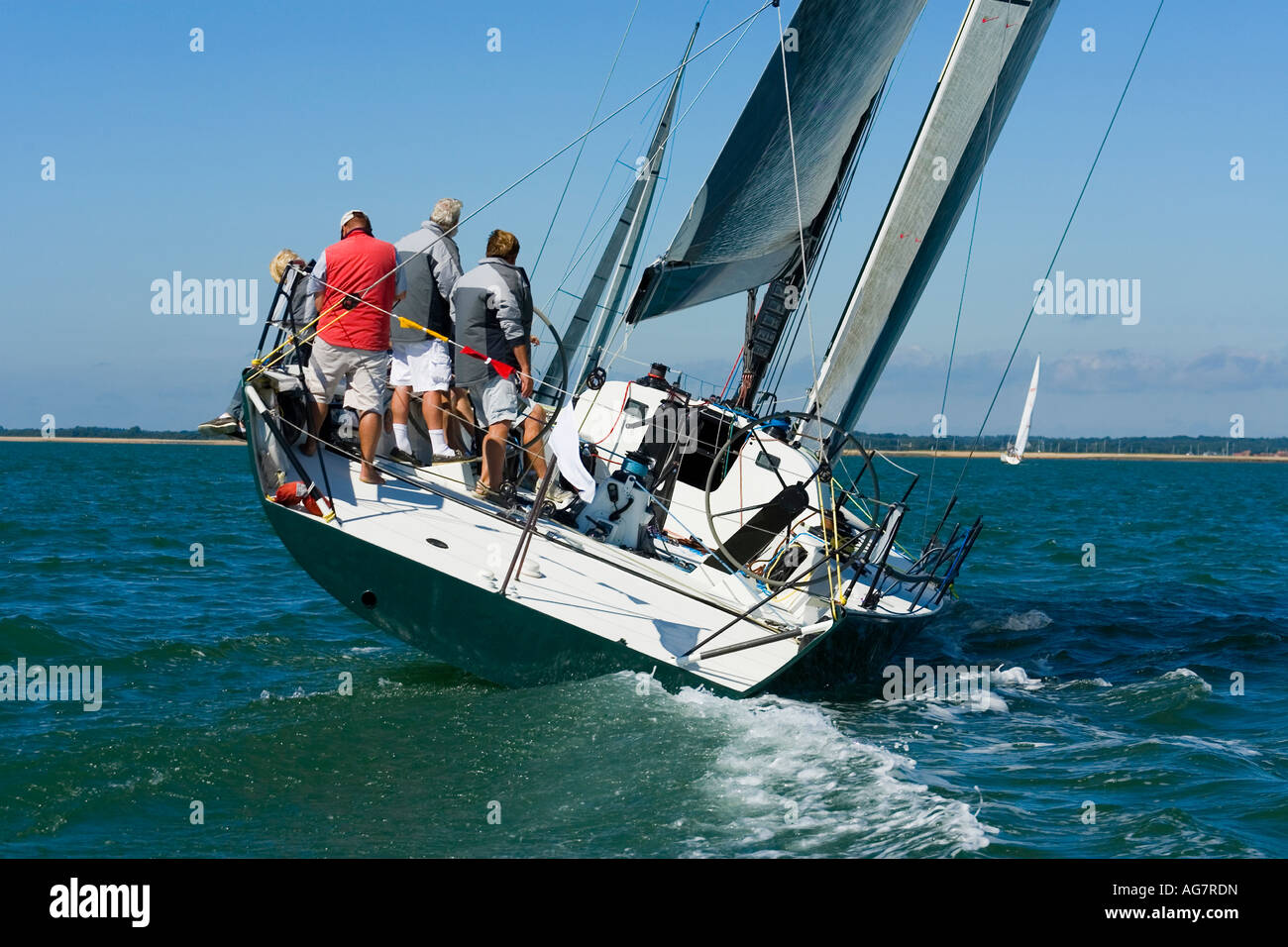 A racing yacht trying to catch up with the other boats in the race Stock Photo