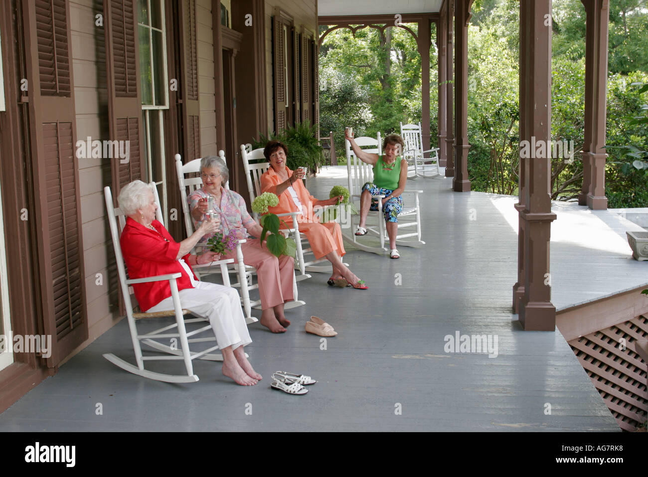 Alabama Barbour County,Eufaula,Fendall Hall,Southern suburban mansion 1860,porch,women,rocking chairs,visitors travel traveling tour tourist tourism l Stock Photo