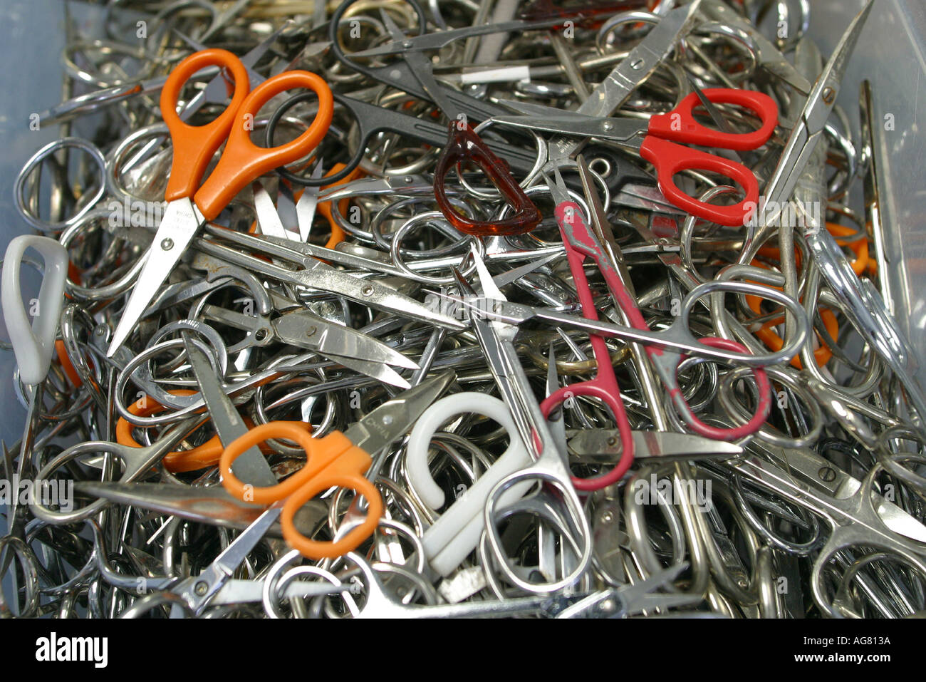 Confiscated items from the airline airport security that were not allowed on the plane including scissors Stock Photo