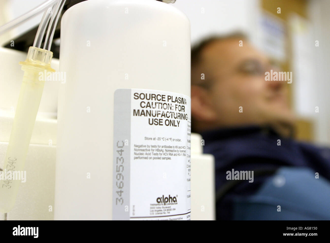 A man donating plasma at a plasma center in Portland Oregon Stock Photo