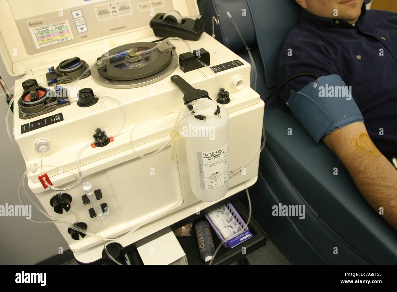 A man donating plasma at a plasma center in Portland Oregon Stock Photo