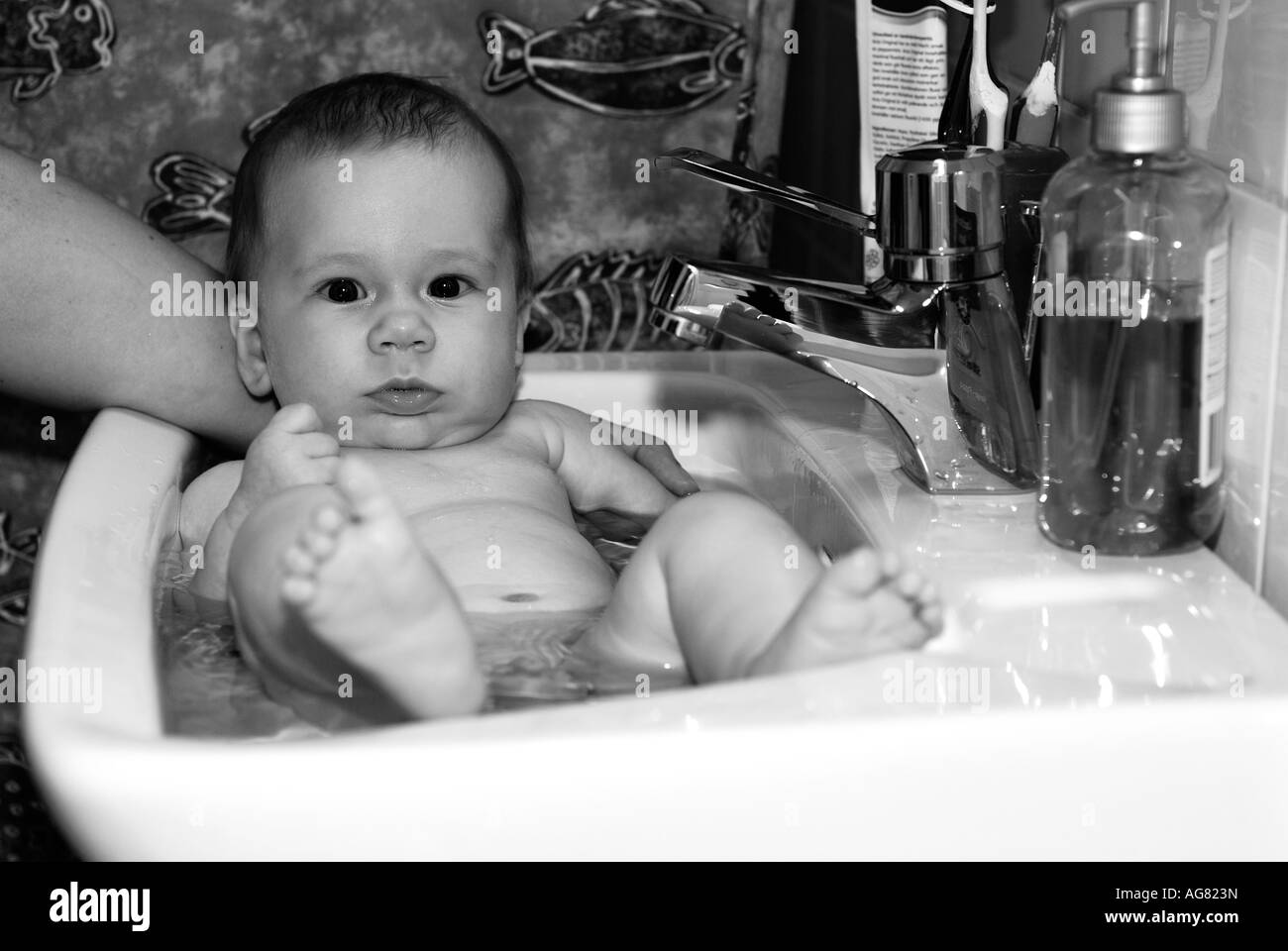 Boy with basin Black and White Stock Photos & Images - Alamy