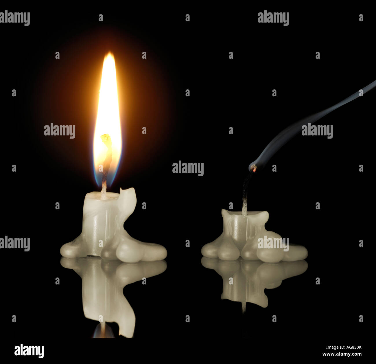 Burning candle and a candle end Energy economy power and light concept
