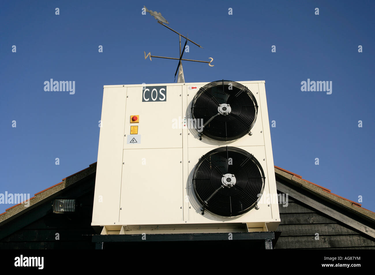 Air conditioning unit affixed to the outside of a shed, West Mersea