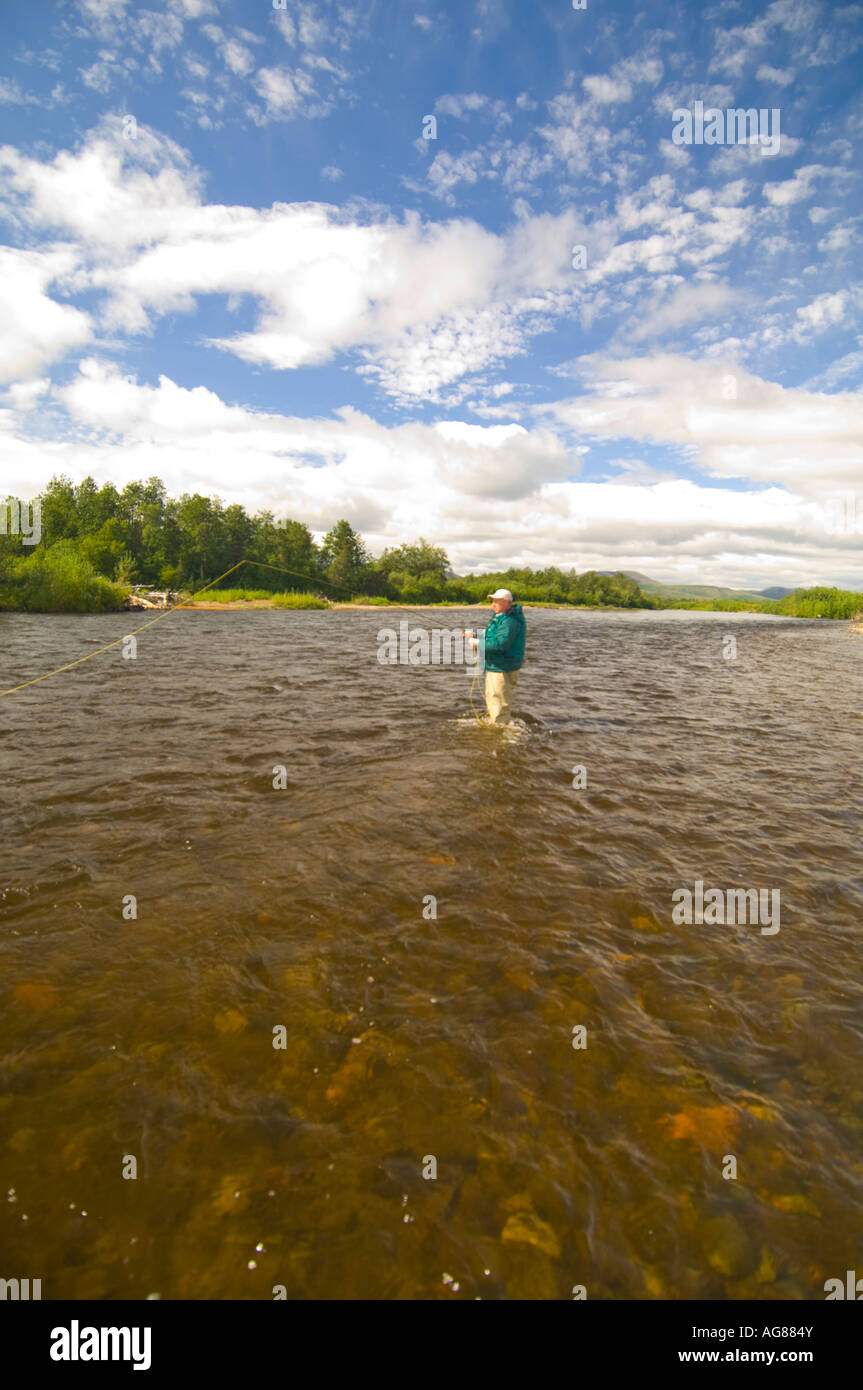 Alaska Southwest Fly fisherman casting for tout and Salmon while fishing on the King Salmon River Stock Photo