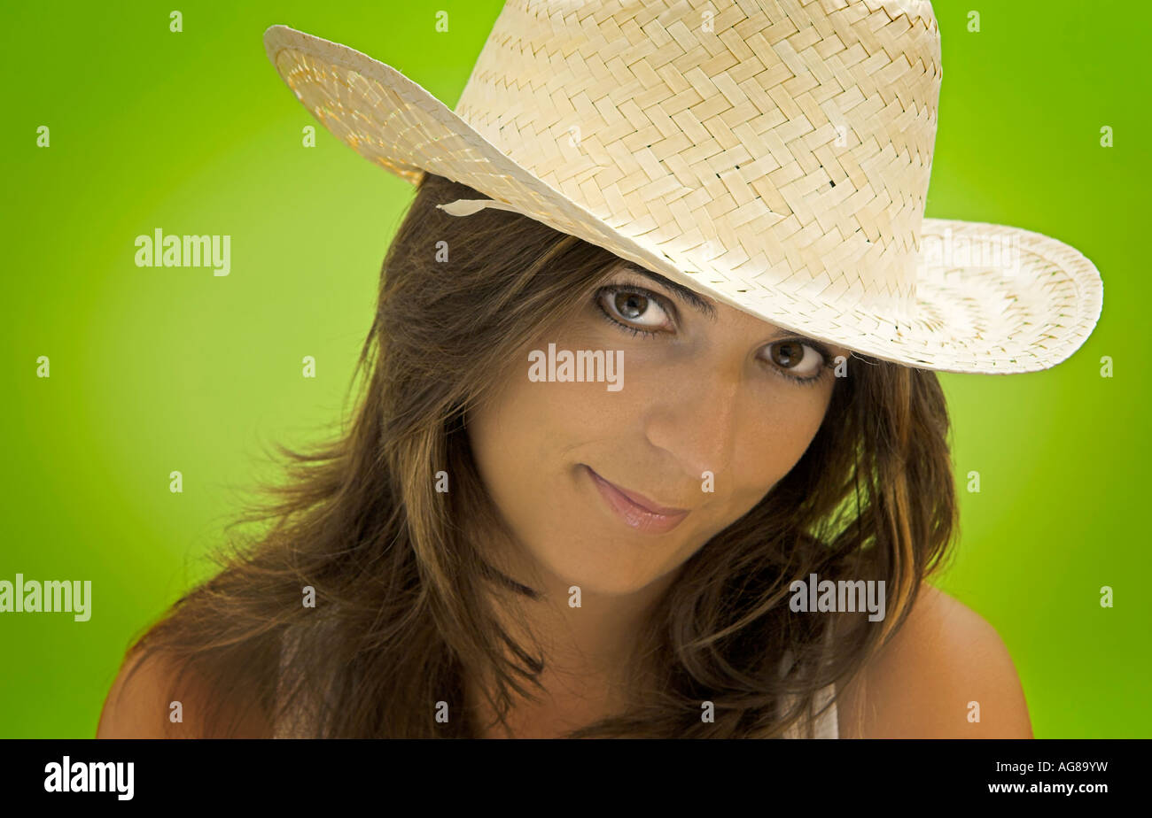 Cowgirl portrait in a green background Stock Photo Alamy