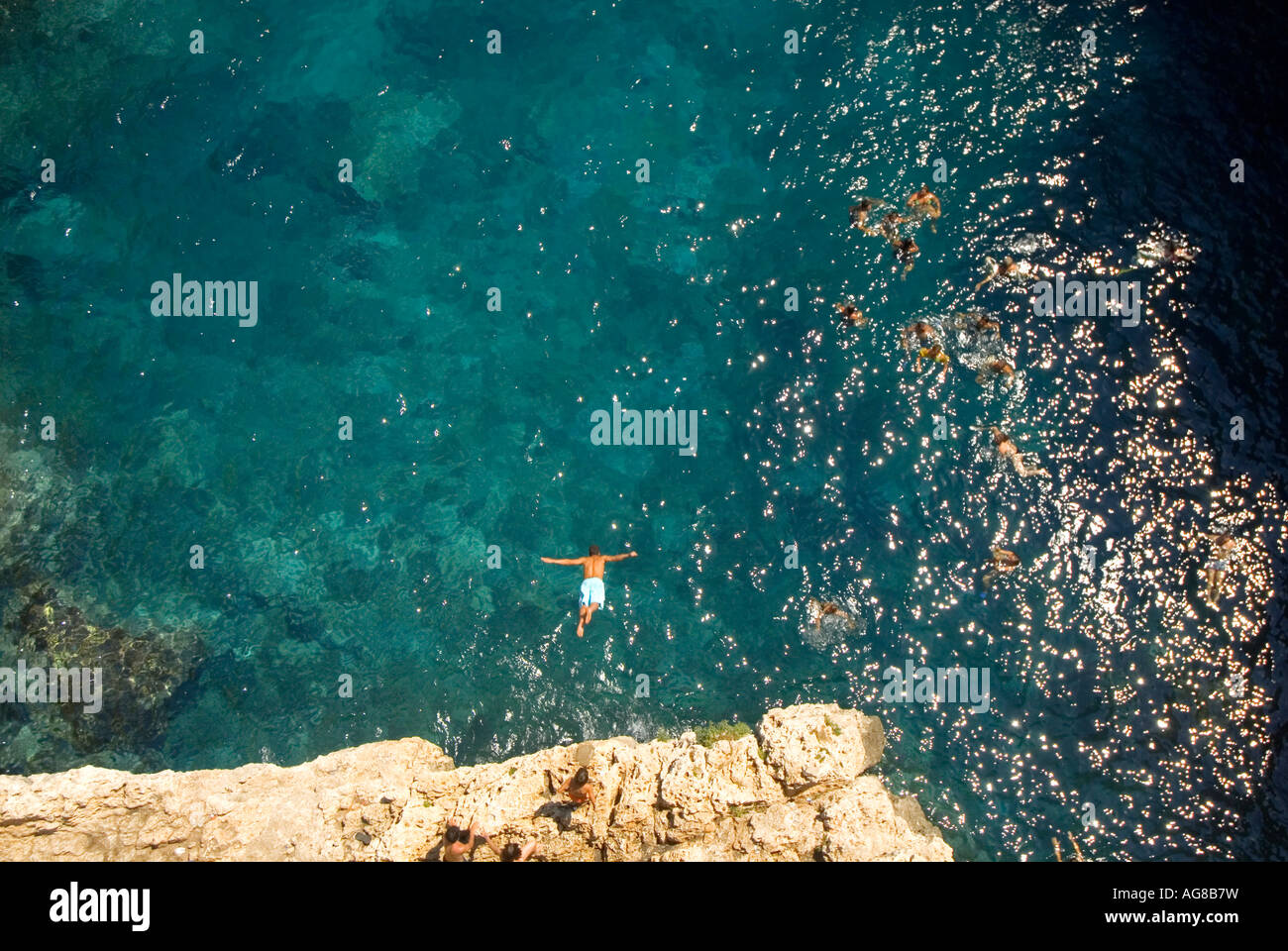 Cliff diver outside of Gagliano del Capo Ionian Sea Puglia Italy Stock Photo