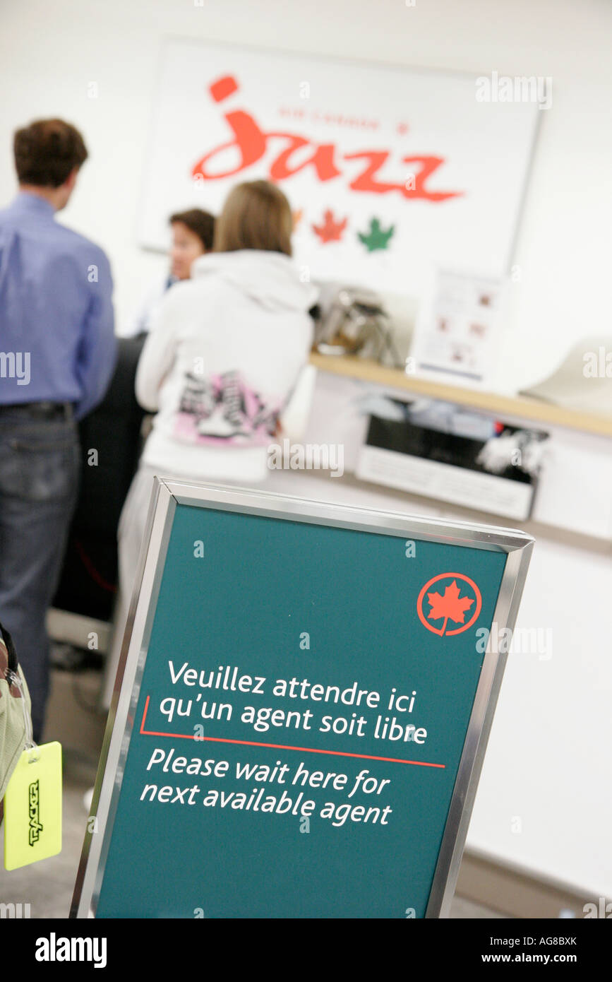 Quebec City Canada,Canadian,North America,American,Jean Lesage International Airport,sign,logo,French English,Air Canada check in desk,visitors travel Stock Photo