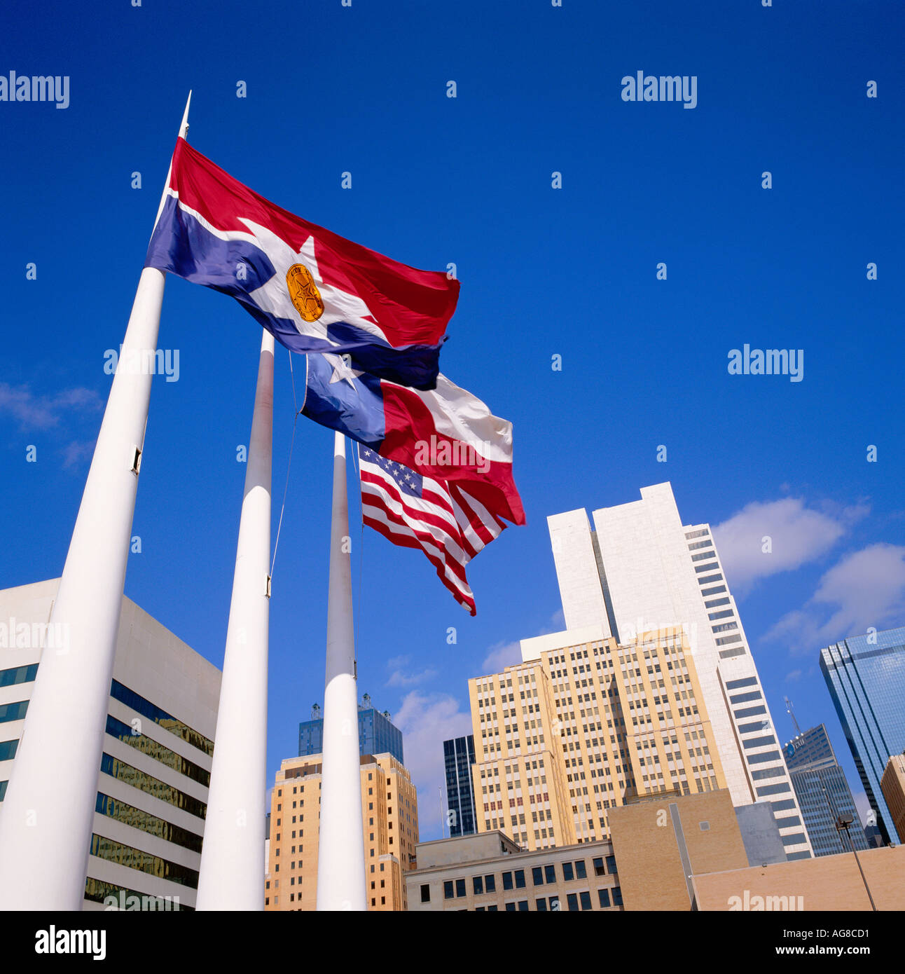 Flags of State of Texas USA Stars and Stripes and City of Dallas flying from flag staff Dallas USA City Hall Plaza Stock Photo