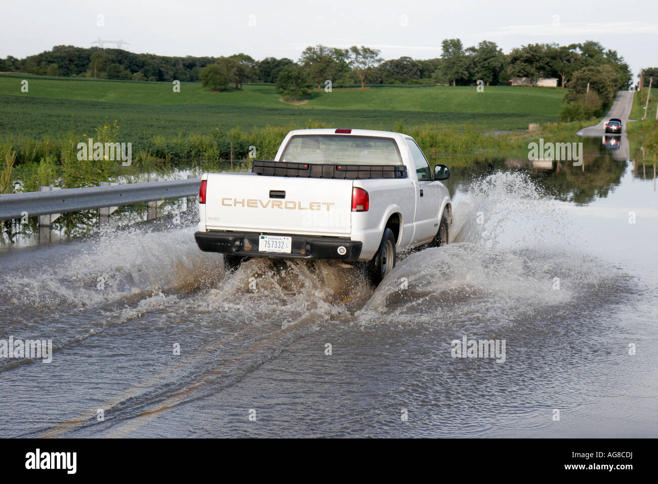 Indiana Lake County,Belshaw,West Creek,flooding,rural road,pickup truck,lorry,high water,IL070824016 Stock Photo