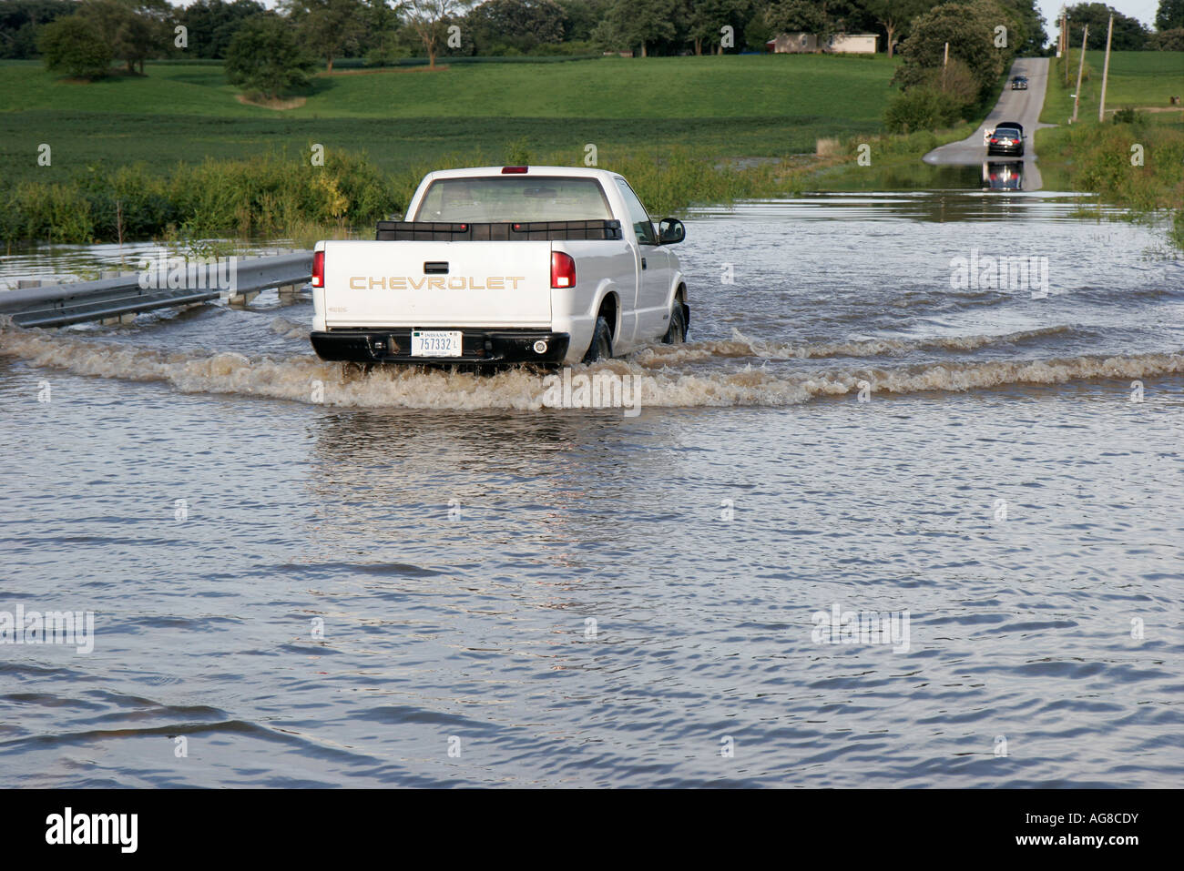 Indiana Lake County,Belshaw,West Creek,flooding,rural road,pickup truck,lorry,high water,IL070824018 Stock Photo