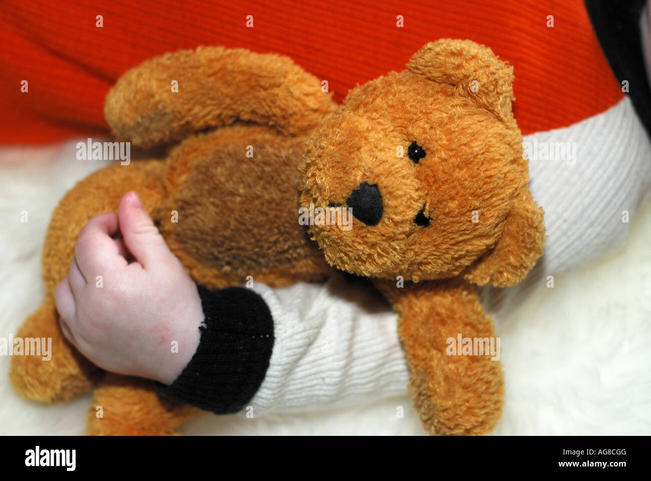 Child with teddy bear hi-res stock photography and images - Alamy