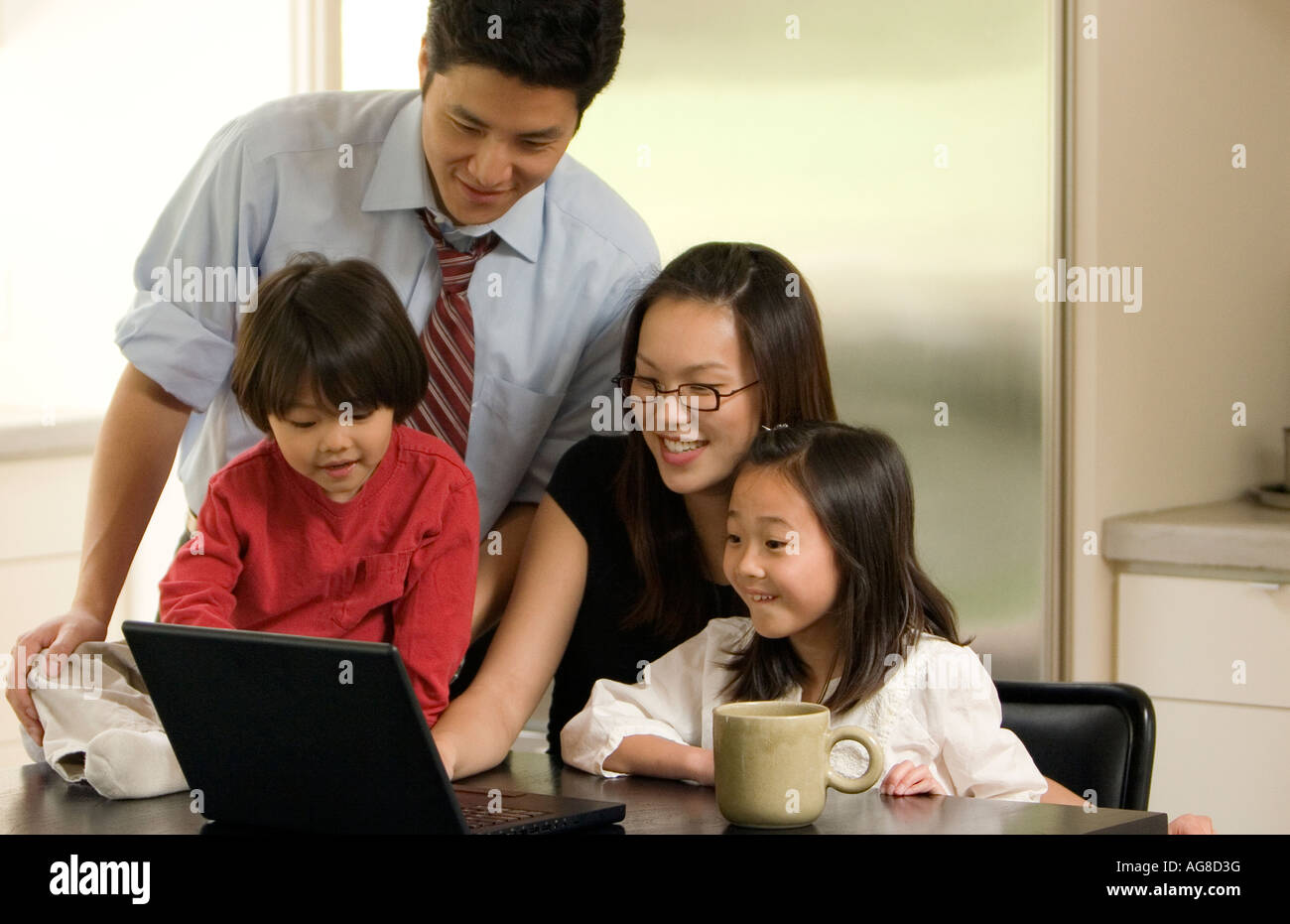 Family Uses Laptop Stock Photo