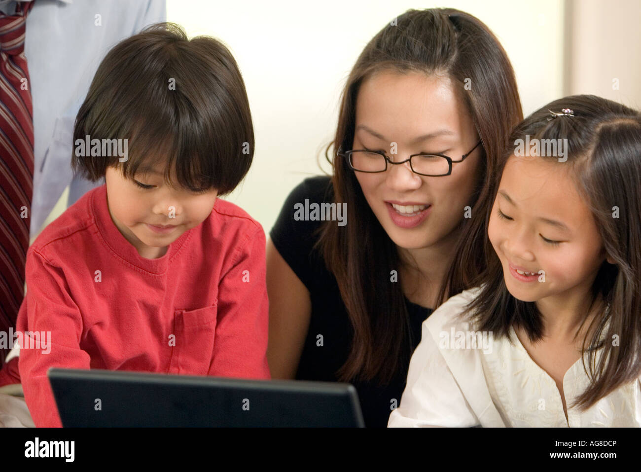 Mother and Children on Laptop Stock Photo - Alamy