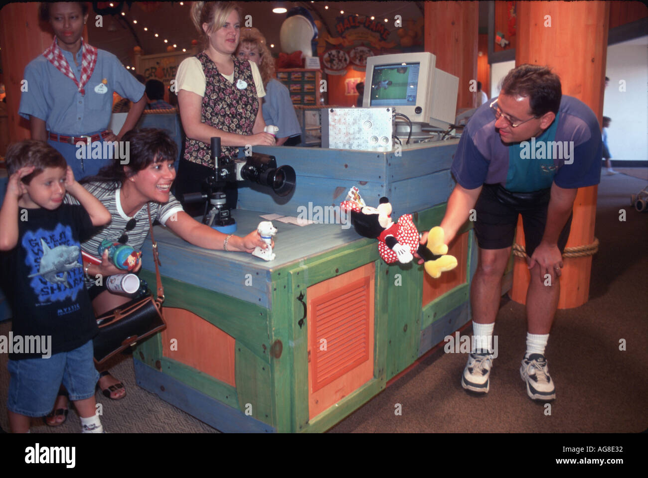 USA. Children playing with character toys in Disneyland, Orlando