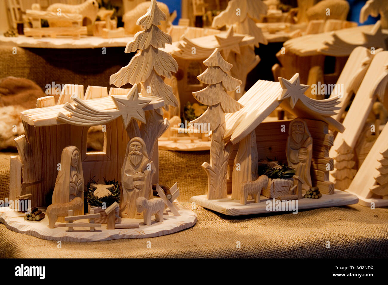 Traditional hand carved wooden cribs on a stall at the Christmas Xmas market in Krakow Cracow Poland Stock Photo