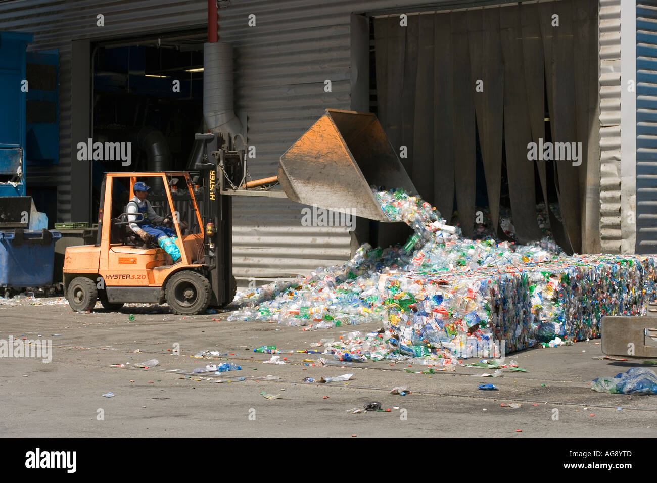 Delivered plastic bottles are being transported into the sorting