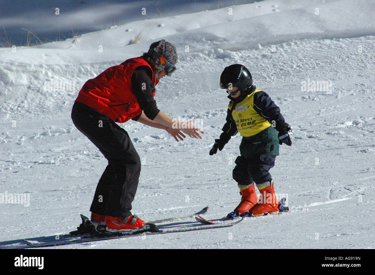 Child takes ski lesson Stock Photo Alamy