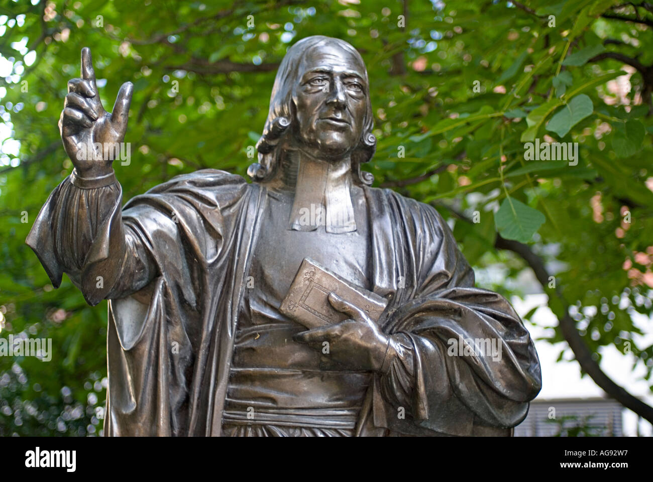 Bronze statue of John Wesley in the gardens of Saint Pauls Cathedral London England United Kingdom Stock Photo