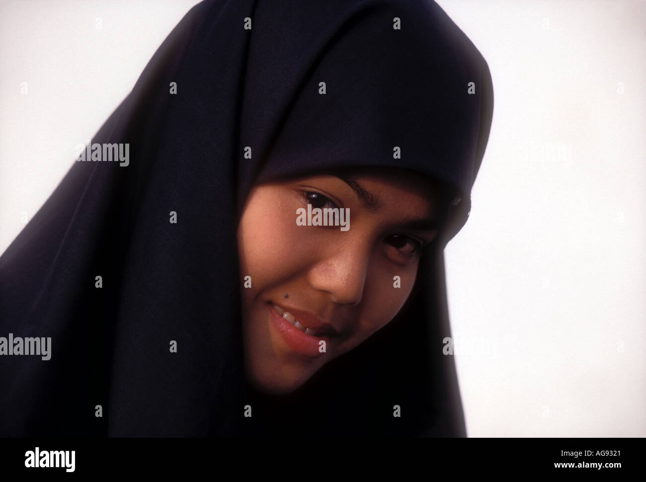 Javanese Muslim girl in Yogyakarta Java Indonesia Southeast Asia Model released image Stock Photo