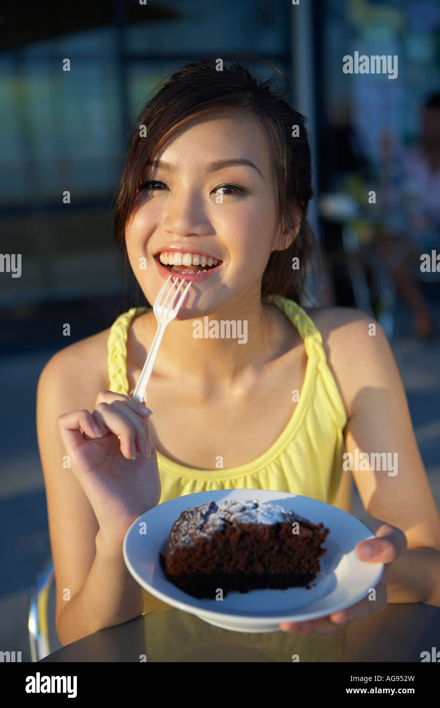 Young Lady Eating Cake Stock Photo Alamy