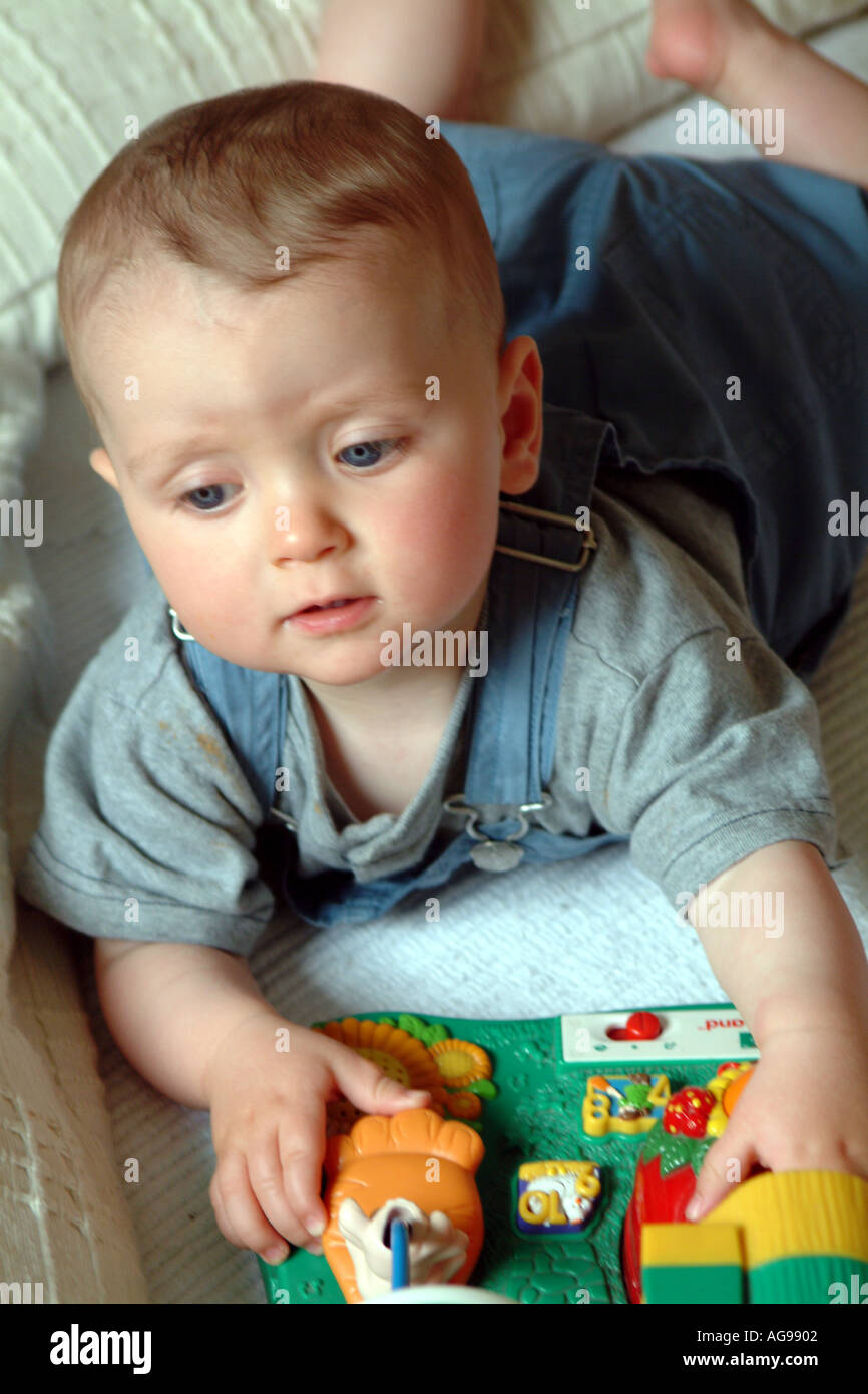 Baby Boy Playing with Toys Stock Photo - Alamy