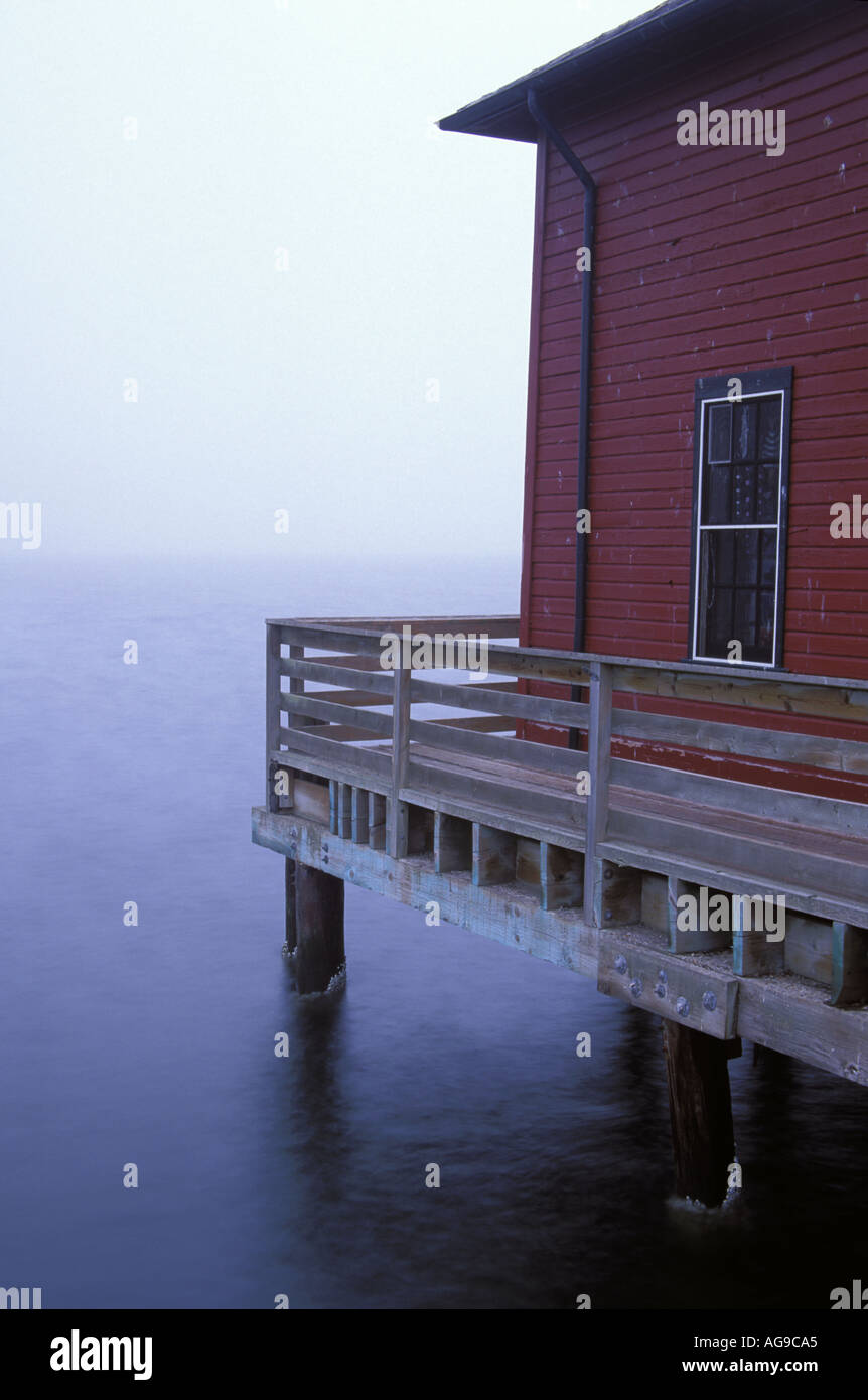 Red building and window on Coupeville Wharf in early morning Coupeville