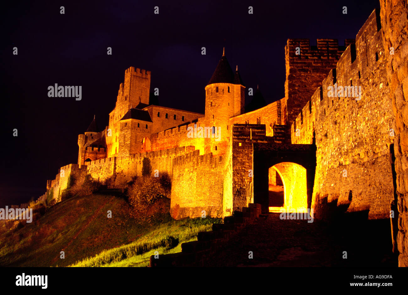 Carcassonne Medieval City France the Count s Castle and West Gate by night Stock Photo