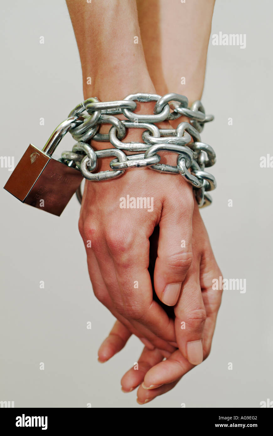 Hands Chained at the Wrists Stock Photo