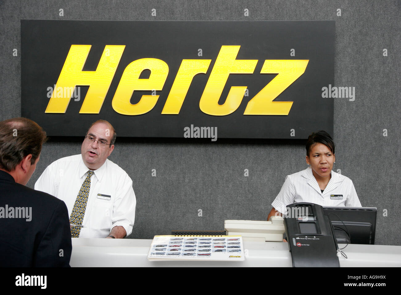 Norfolk Virginia,Norfolk International Airport,Hertz Rental Car,rent,customer service desk,Black woman female women,VA070611065 Stock Photo