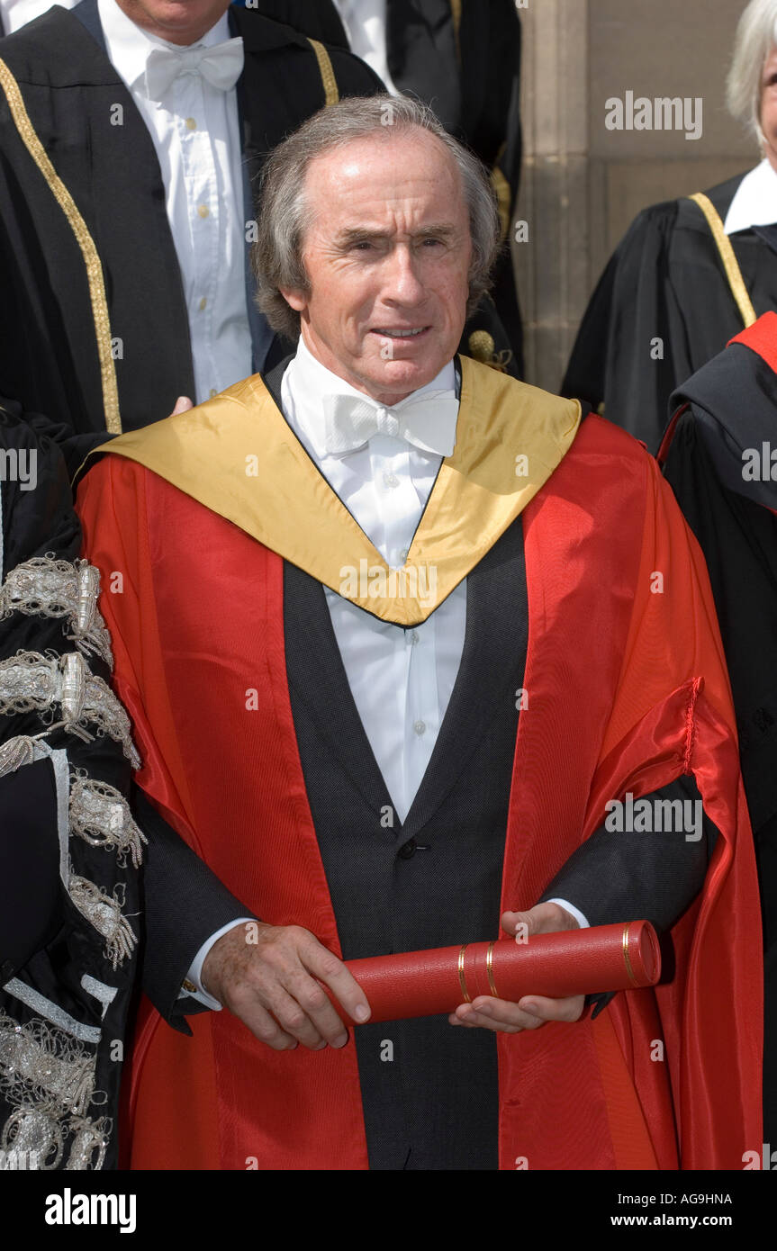 Former F1 racing driver Sir Jackie Stewart, with his wife, receiving an honorary degree from the University of Edinburgh Stock Photo